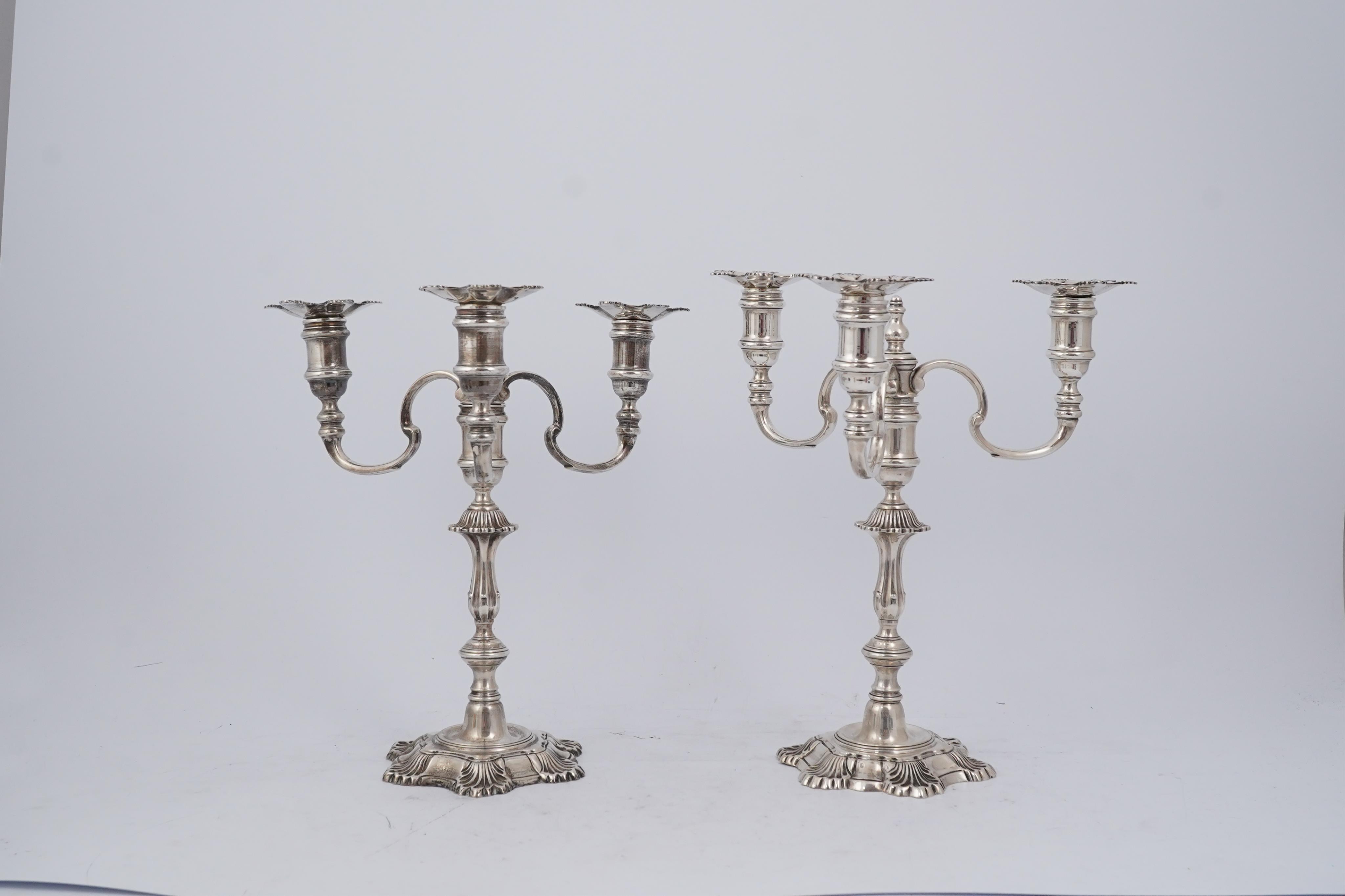 A pair of Elizabeth II cast silver three branch, three light candelabra, by J.B. Chatterley & Sons Ltd